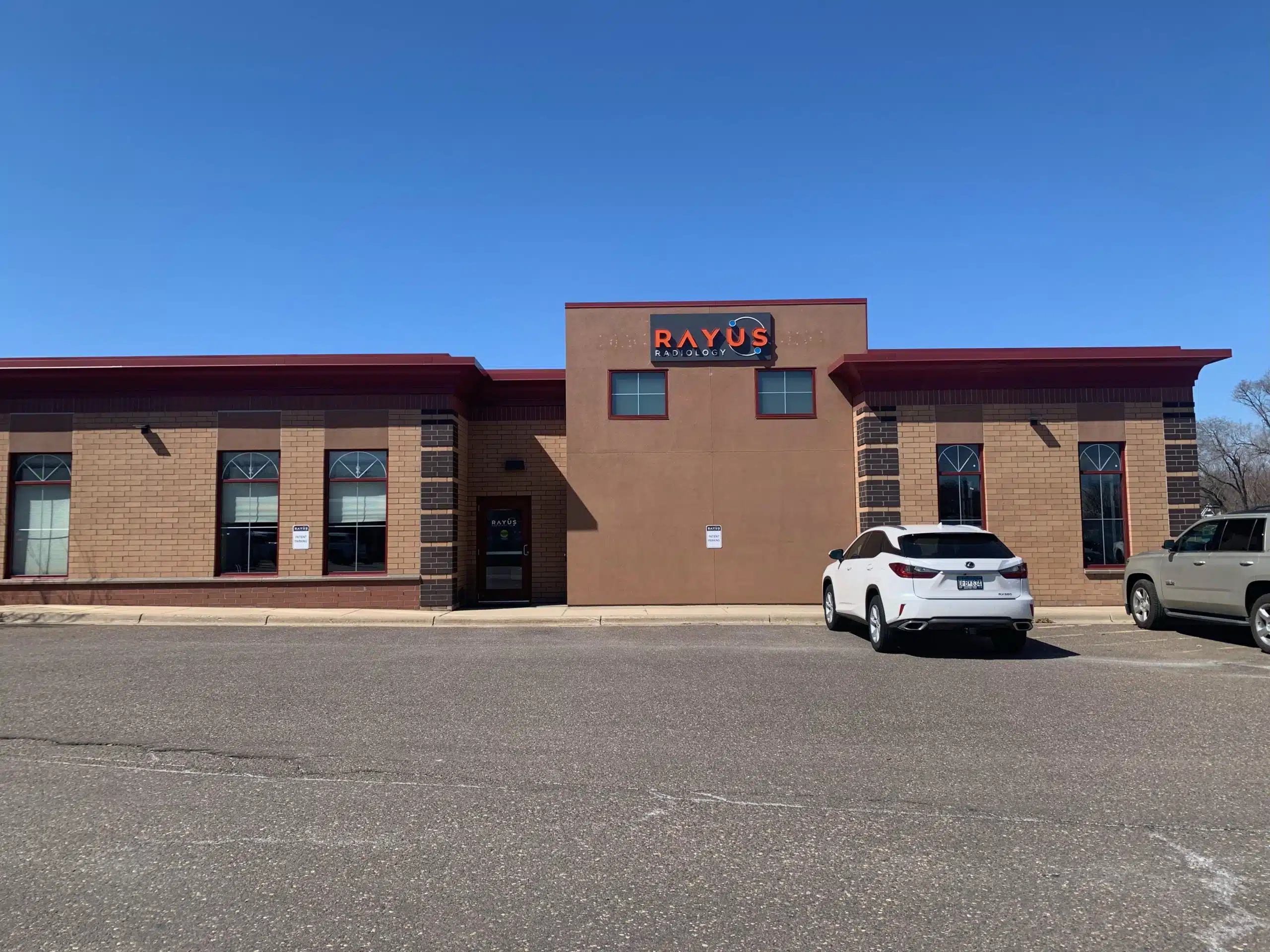 RAYUS Radiology diagnostic imaging center in 2601 Centennial Dr., Suite 108, North St. Paul, MN 55109 brown building