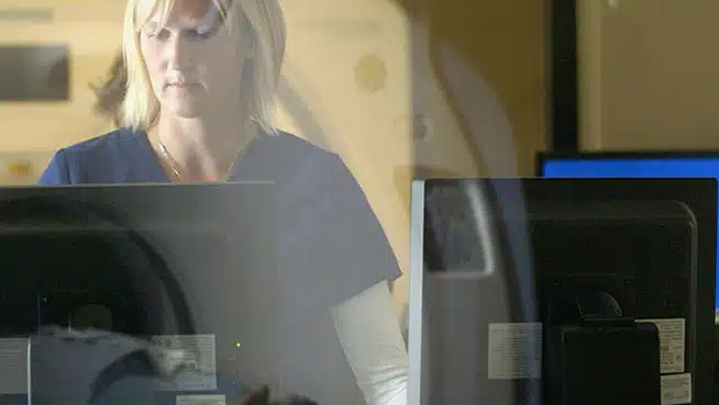 ct tech looking at computer