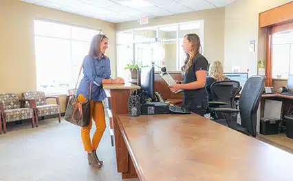 female patient checking in in lobby
