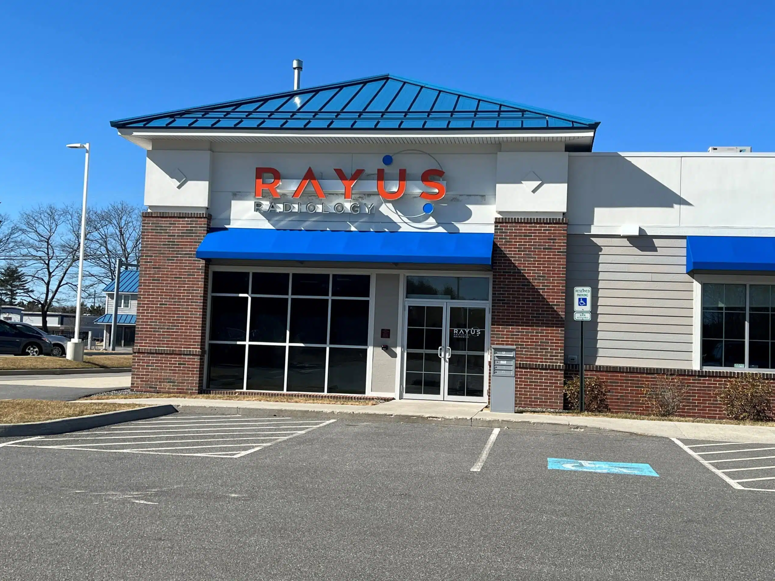 RAYUS Radiology diagnostic imaging center in 2 Admiral Fitch Ave., Suite A, Brunswick, ME 04011 blue roof