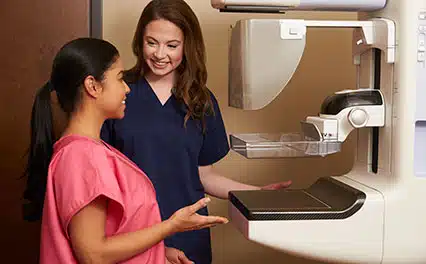 mammo tech with patient