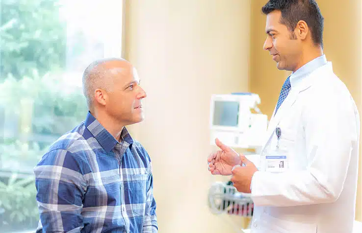 male doctor talking with male patient