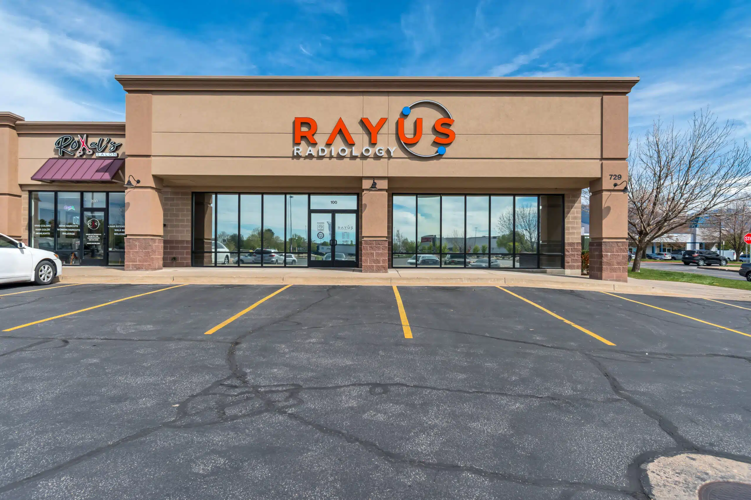 RAYUS Radiology Layton Utah exterior brick building with orange signage