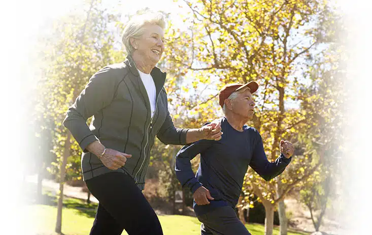 man and woman running while smiling regen