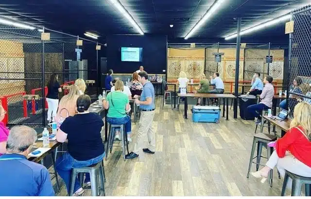 Axe throwing event for hand and foot Doctors, our rad Dr. Demertzis spoke
