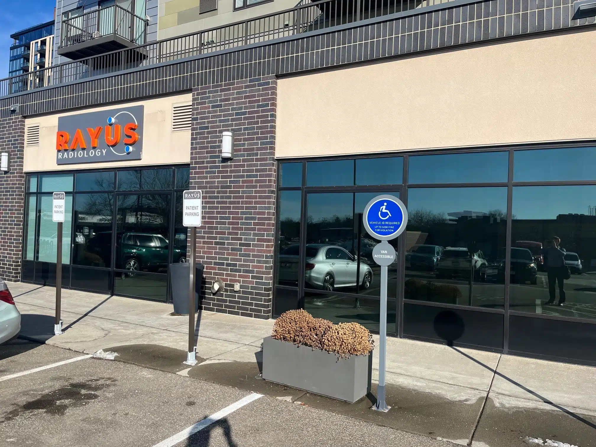 RAYUS Radiology outdoor signage in Edina, Minnesota below apartments