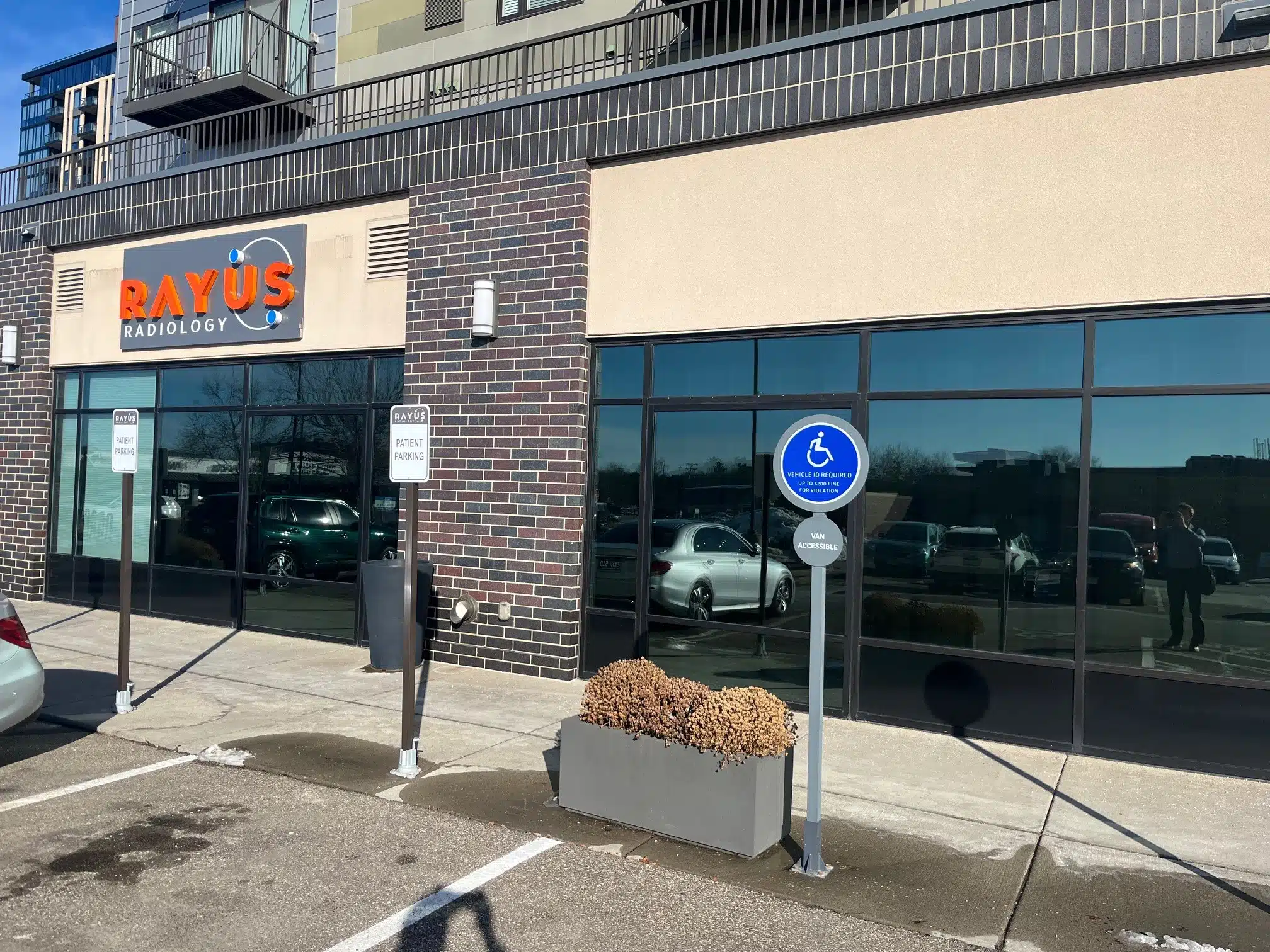 RAYUS Radiology outdoor signage in Edina, Minnesota below apartments