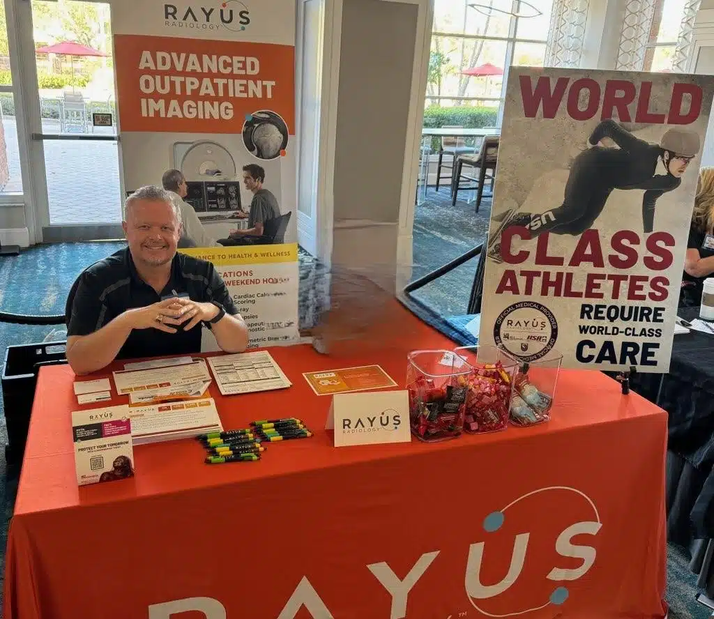 smiling man at RAYUS booth