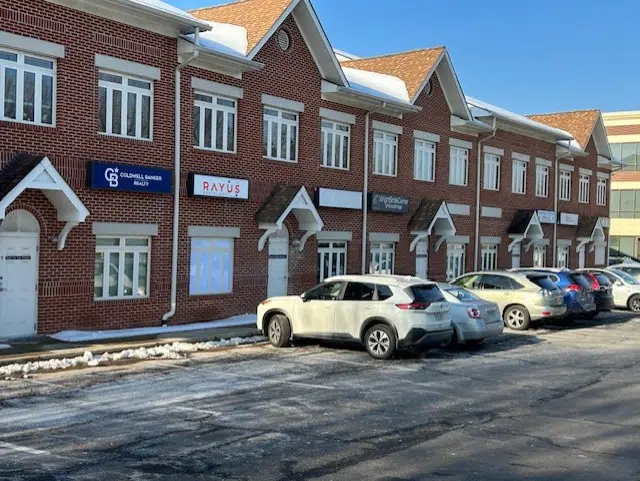 RAYUS Radiology Woodbridge CT brown brick building exterior next to other businesses